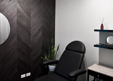 Modern treatment room at The Whitening Co - Whangarei in Whangārei, Northland, NZ with sleek black decor.