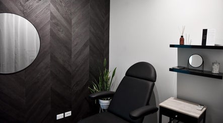 Modern treatment room at The Whitening Co - Whangarei in Whangārei, Northland, NZ with sleek black decor.