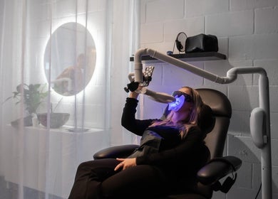 Client in a sleek chair receiving teeth whitening at The Whitening Co - Whangarei, Whangārei, Northland, NZ.