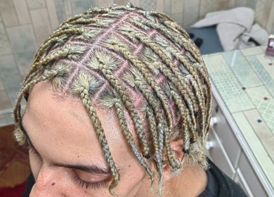 Intricate braided hairstyle at Aneric Hair Salon, Johannesburg, Gauteng, ZA showcasing precision and style.