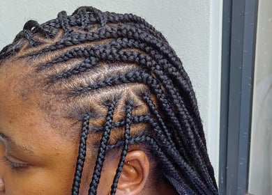 Intricate braid hairstyle at Aneric Hair Salon in Johannesburg, Gauteng, ZA. Perfect for stylish, modern looks.