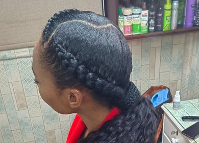 Stylish braided hairstyle at Aneric Hair Salon in Johannesburg, Gauteng, ZA. Reflects modern beauty trends.