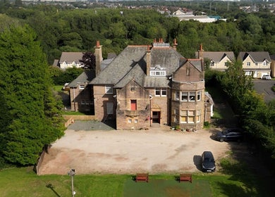Aerial view of Hair by Keri Muir, located in a picturesque estate in Larbert, Scotland, GB, surrounded by greenery.