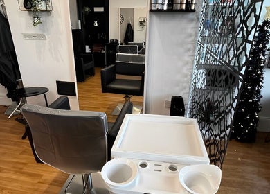 Stylish salon setup at Hair by Keri Muir in Larbert, Scotland, GB with modern chairs and decor.
