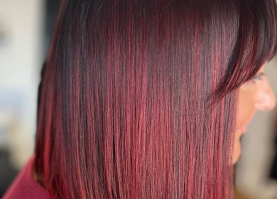 Close-up of radiant crimson hair styled at Hair by Keri Muir, Larbert, Scotland, GB.