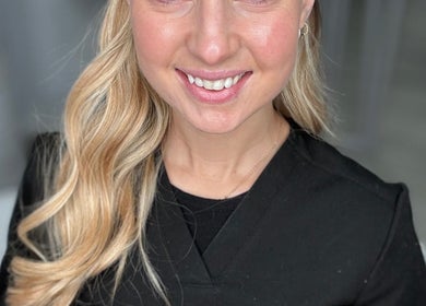 Beauty professional at Natalie Mcintyre Aesthetics, Bishopbriggs, Scotland, GB, showcasing glowing skin and expertise.
