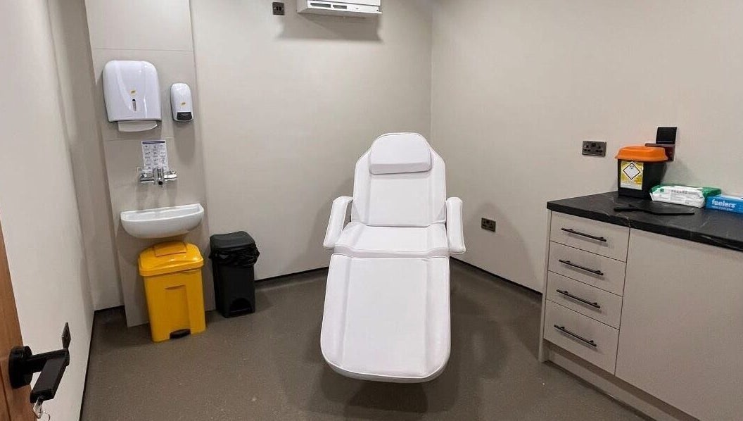 Modern treatment room at Natalie Mcintyre Aesthetics, Bishopbriggs, Scotland, GB. Features a reclining chair.
