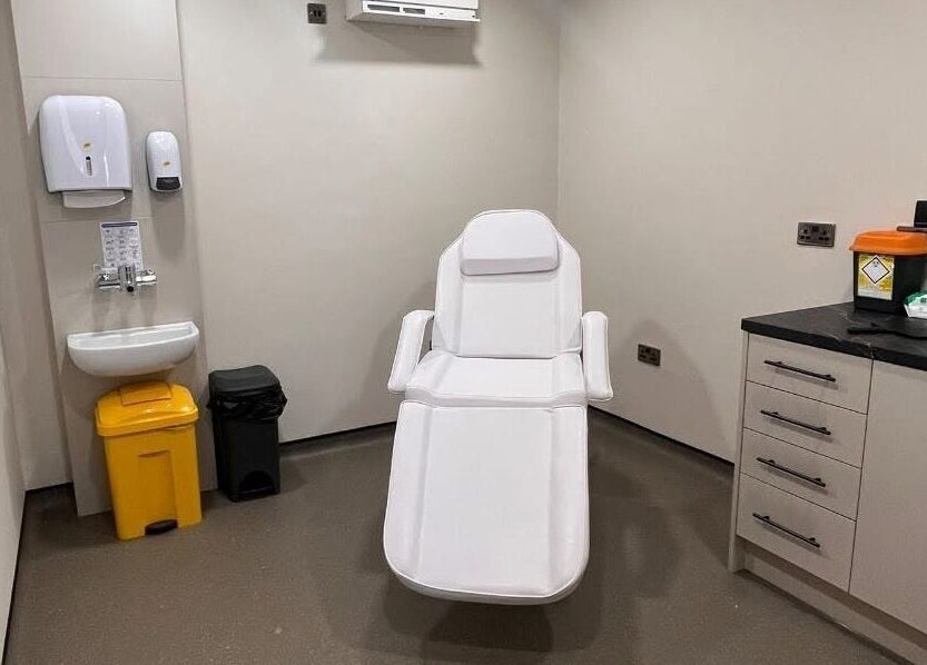 Modern treatment room at Natalie Mcintyre Aesthetics, Bishopbriggs, Scotland, GB. Features a reclining chair.