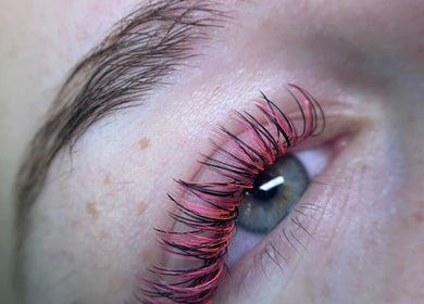 Close-up of vibrant pink and black eyelash extensions at Burst of Beauty, Weymouth, England, GB.
