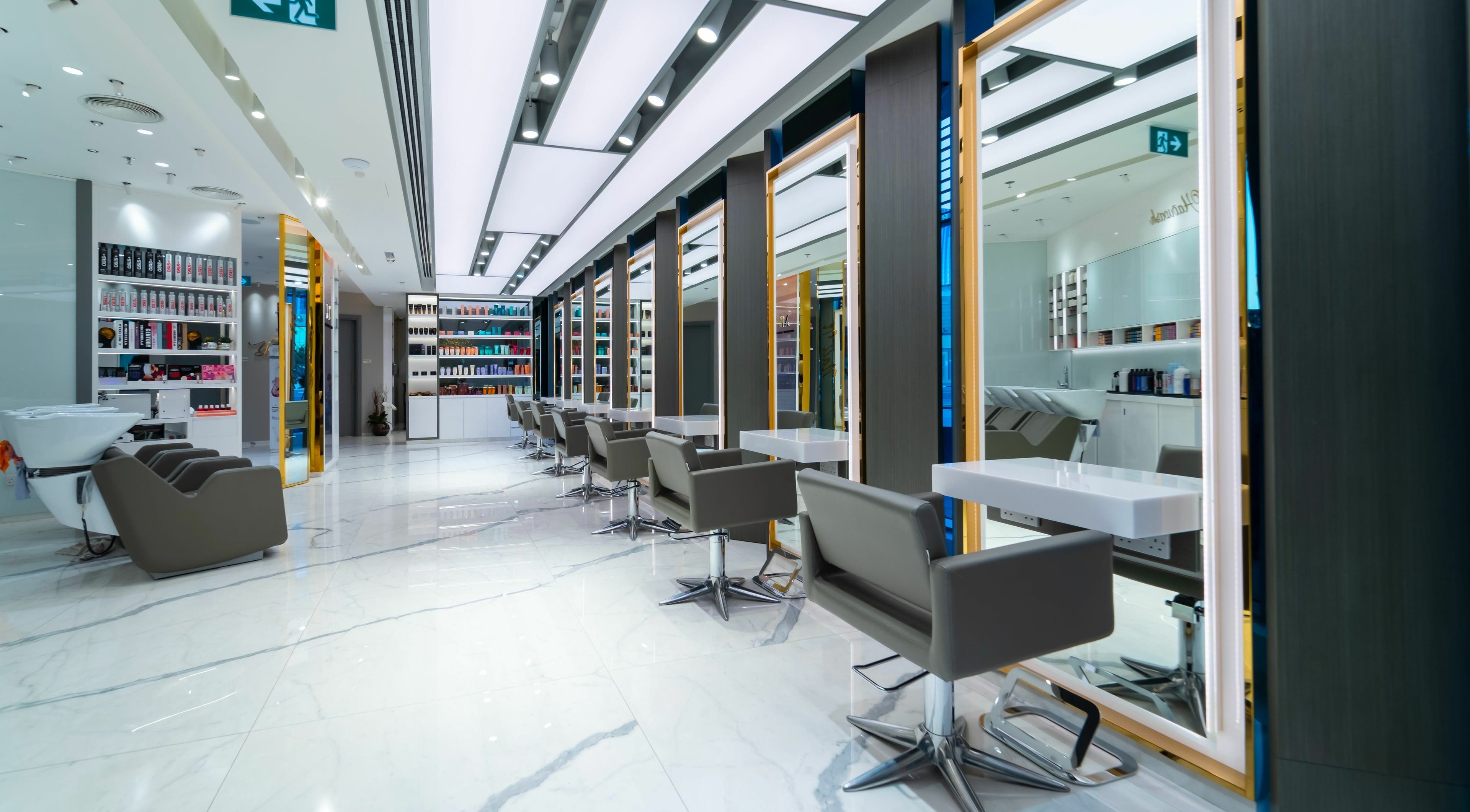 Modern salon seating and mirrors at Mokhtar Safadi Beauty Lounge, Dubai, Dubai, AE, reflecting luxury and style.