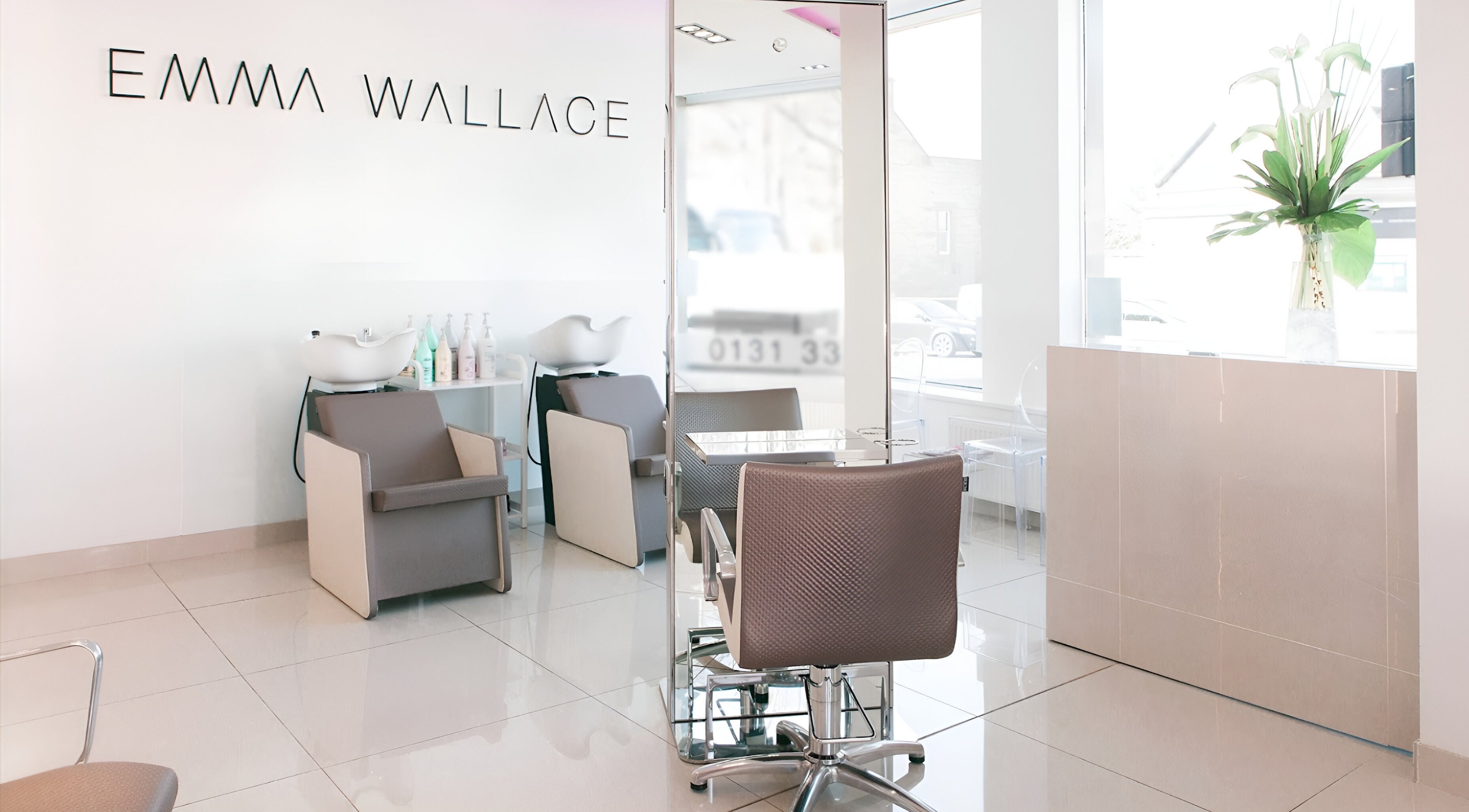 Modern salon setup at Victoria Ghirelli Hair, Edinburgh, Scotland, GB. Sleek chairs and wash stations.