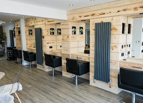 Modern salon interior at Marcia & Co, Freckleton, England, GB, highlighting stylish seats and mirrors.