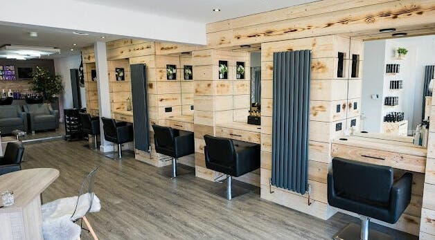 Modern salon interior at Marcia & Co, Freckleton, England, GB, highlighting stylish seats and mirrors.