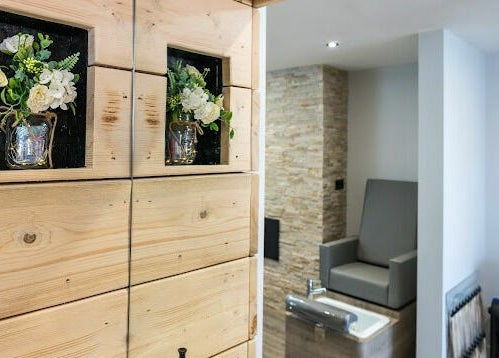 Chic wooden decor with flowers at Marcia & Co, Freckleton, England, GB. Warm and inviting spa ambiance.