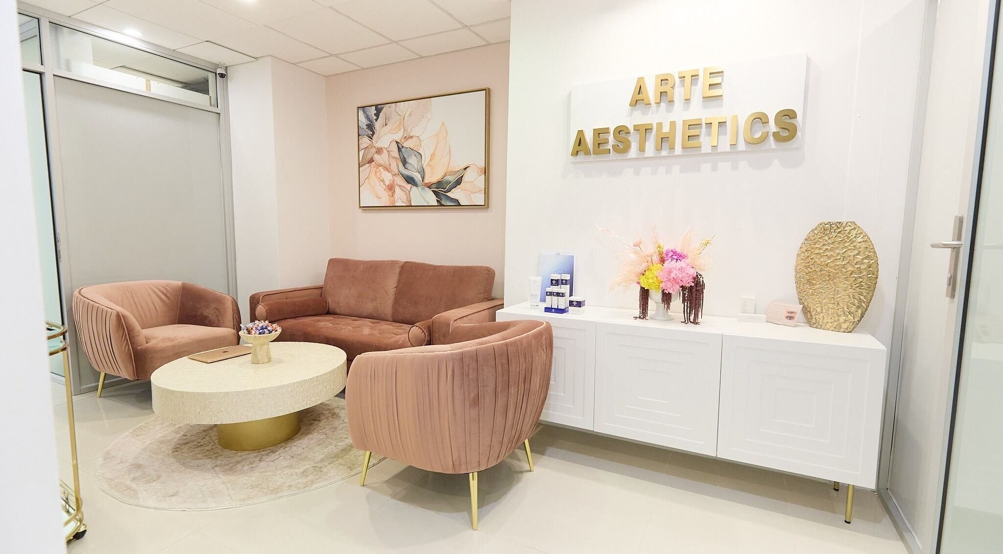 Elegant lounge at Arte Aesthetics, Sydney, New South Wales, AU, featuring plush seating and tasteful decor.