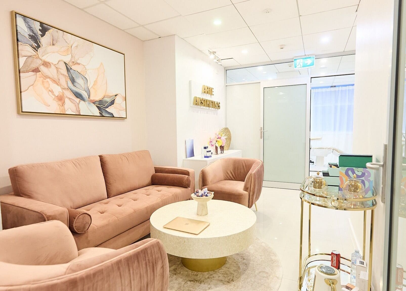 Stylish lounge area at Arte Aesthetics, Sydney, New South Wales, AU with plush seating and modern decor.