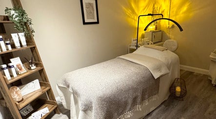 Relaxing treatment room at Radiant Skin Clinic, Peterborough, England, GB features a cozy spa bed and soothing decor.