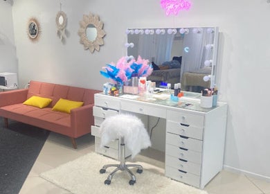Elegant makeup station at Beauty Bar n Makeup, Lash n Brows in Auckland, Auckland, NZ with pink decor.