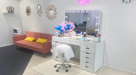 Elegant makeup station at Beauty Bar n Makeup, Lash n Brows in Auckland, Auckland, NZ with pink decor.