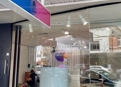 Exterior view of Beauty Bar n Makeup, Lash n Brows in Auckland, NZ, showcasing modern glass facade.