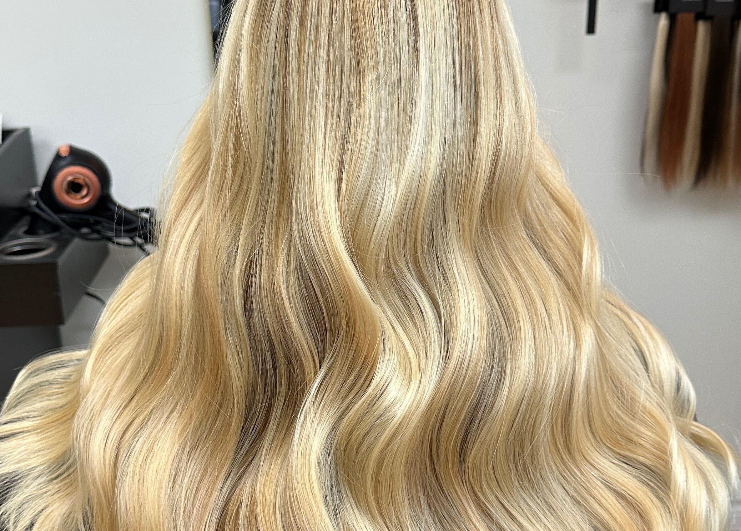 Blonde wavy hair styled by Krystina in Dollard-des-Ormeaux, Québec, CA at a beauty salon.