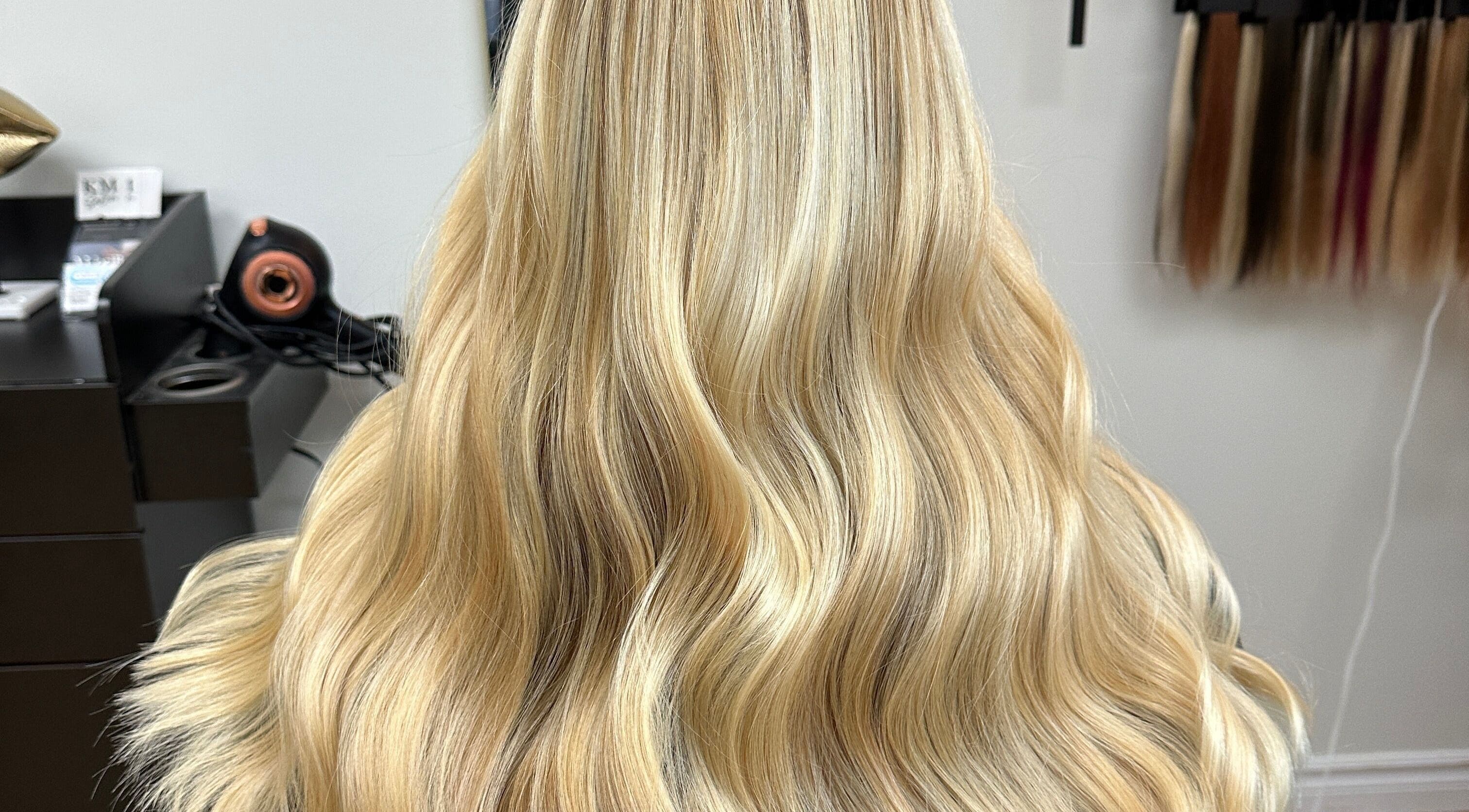 Blonde wavy hair styled by Krystina in Dollard-des-Ormeaux, Québec, CA at a beauty salon.