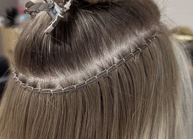 Expert hair extensions application at Styled by Krystina, Dollard-des-Ormeaux, Québec, CA.