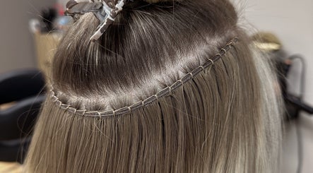 Expert hair extensions application at Styled by Krystina, Dollard-des-Ormeaux, Québec, CA.