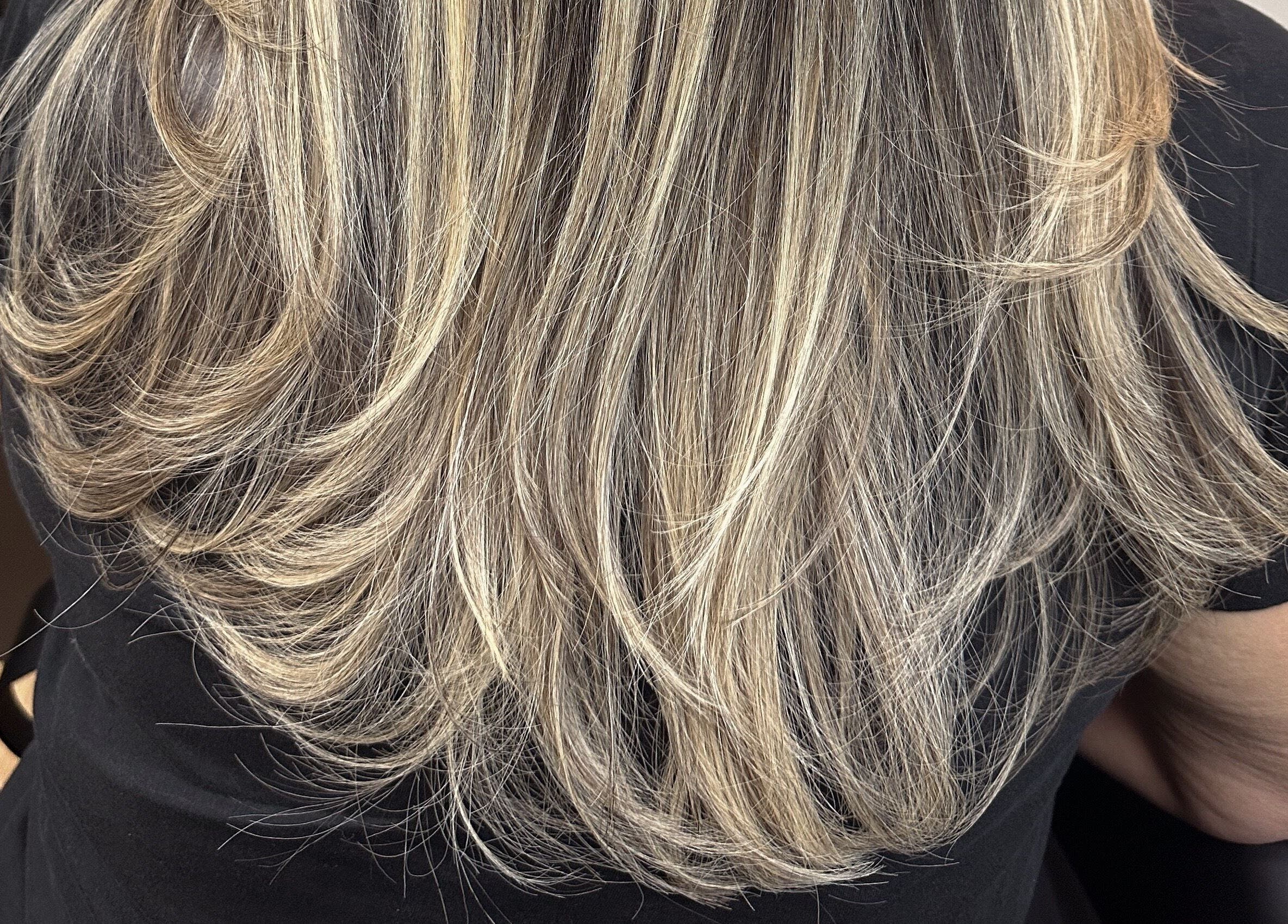 Blonde layered hairstyle styled at Styled by Krystina, Dollard-des-Ormeaux, Québec, CA.