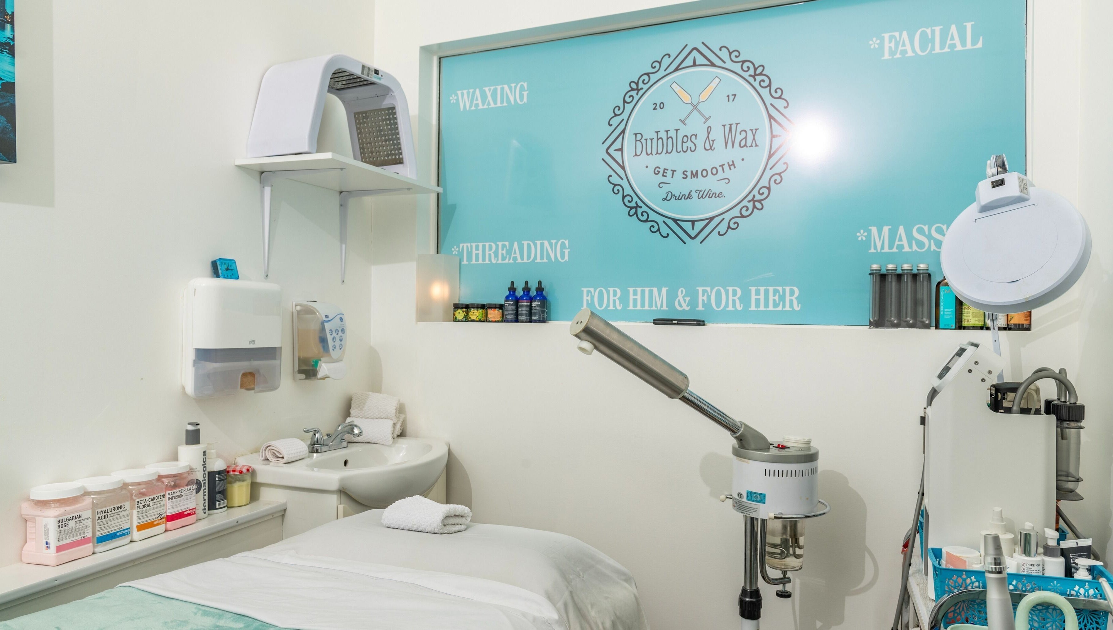 Bubbles and Wax Bar's peaceful treatment room in Surrey, British Columbia, CA, featuring spa essentials.