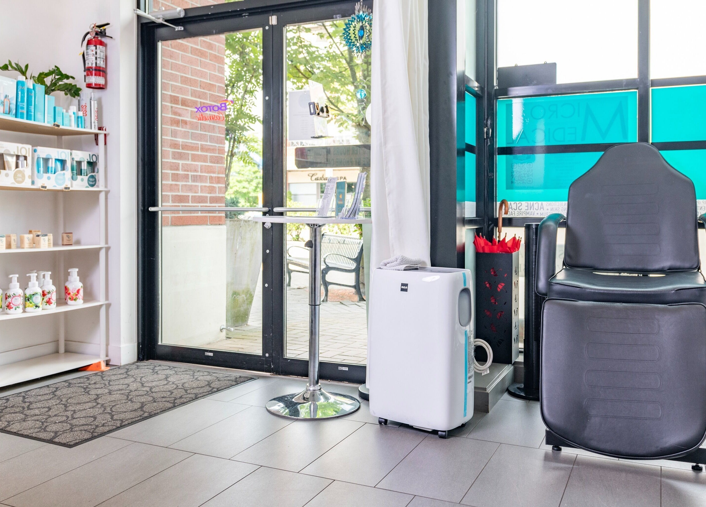 Stylish entrance of Bubbles and Wax Bar, Surrey, BC, showing product display and seating area.