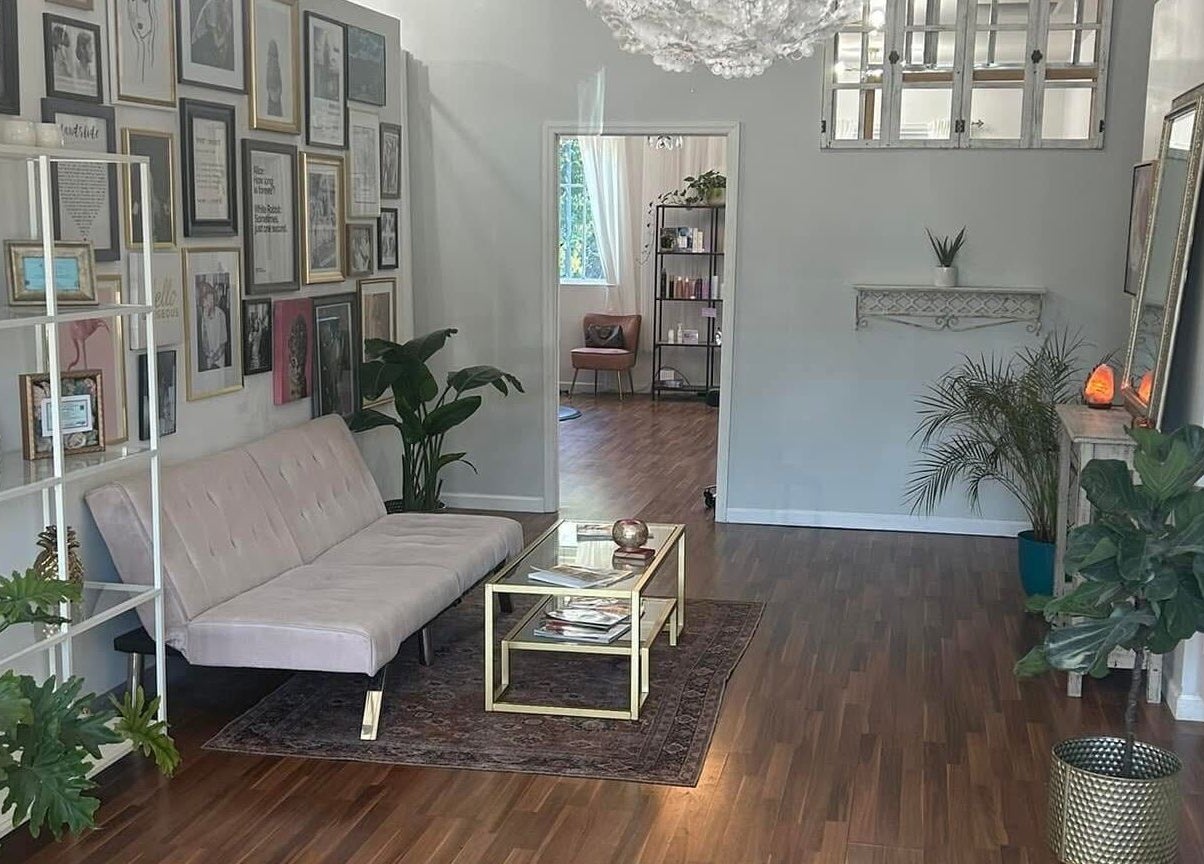 Stylish waiting area at Haley Stapleton, Matthews, North Carolina, US with chic decor and plants.