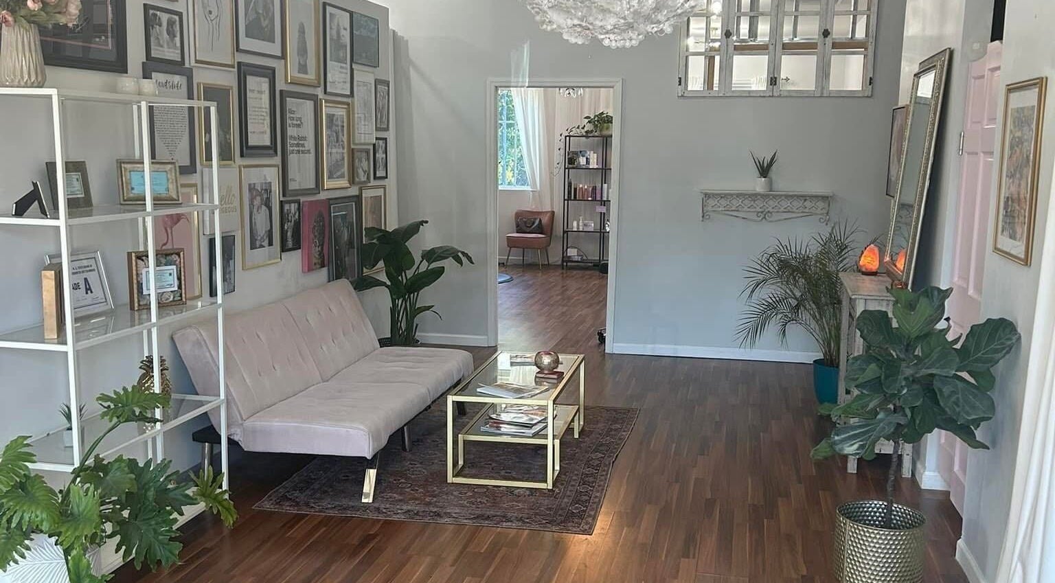 Stylish waiting area at Haley Stapleton, Matthews, North Carolina, US with chic decor and plants.