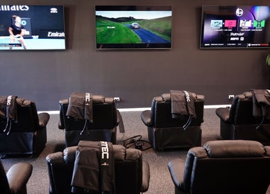 Relaxing recovery lounge with leather recliners and screens at Ark Sports Recovery, Belmont, Victoria, AU.