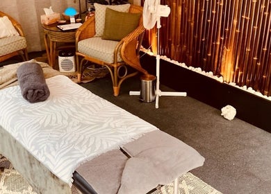 Peaceful massage room at Synergy Fitness and Wellbeing, Melbourne, Victoria, AU, with bamboo decor.