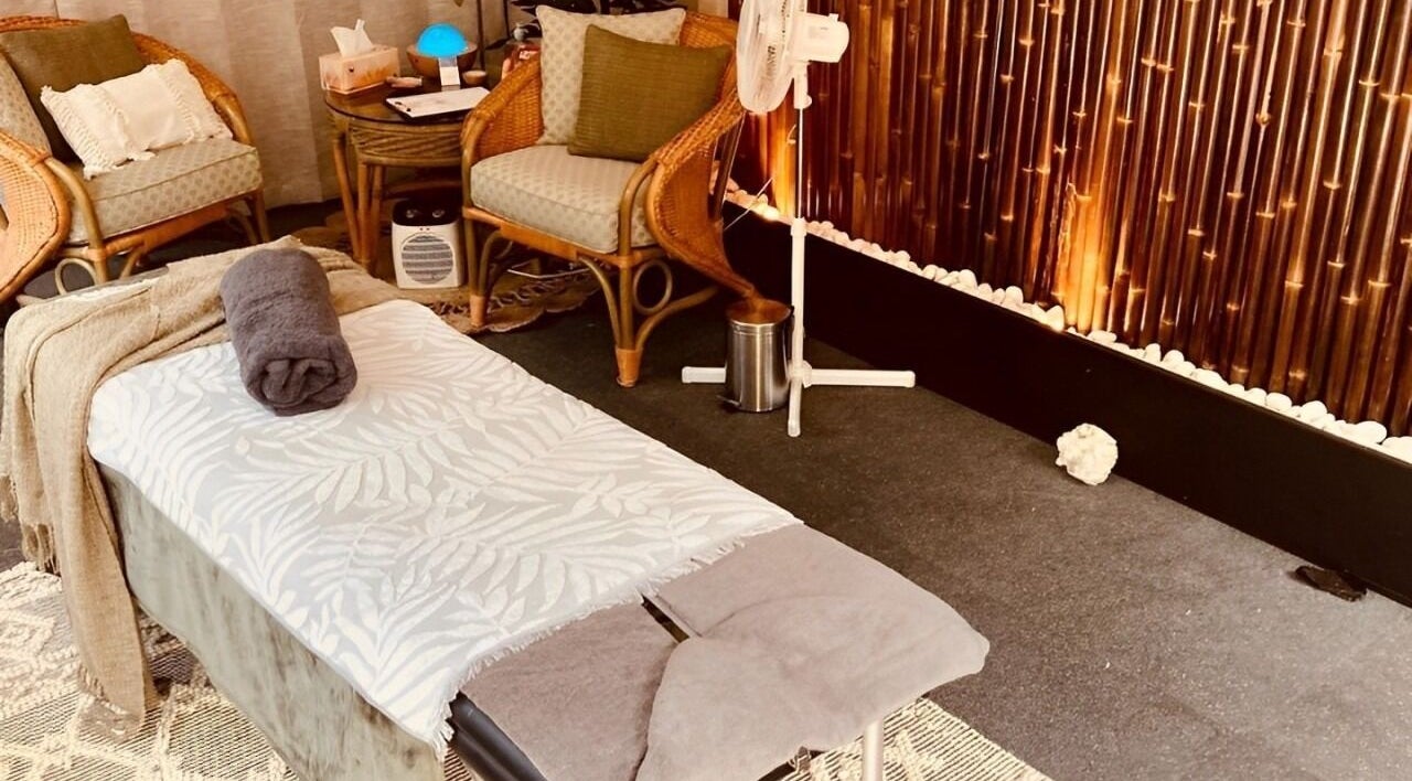 Peaceful massage room at Synergy Fitness and Wellbeing, Melbourne, Victoria, AU, with bamboo decor.