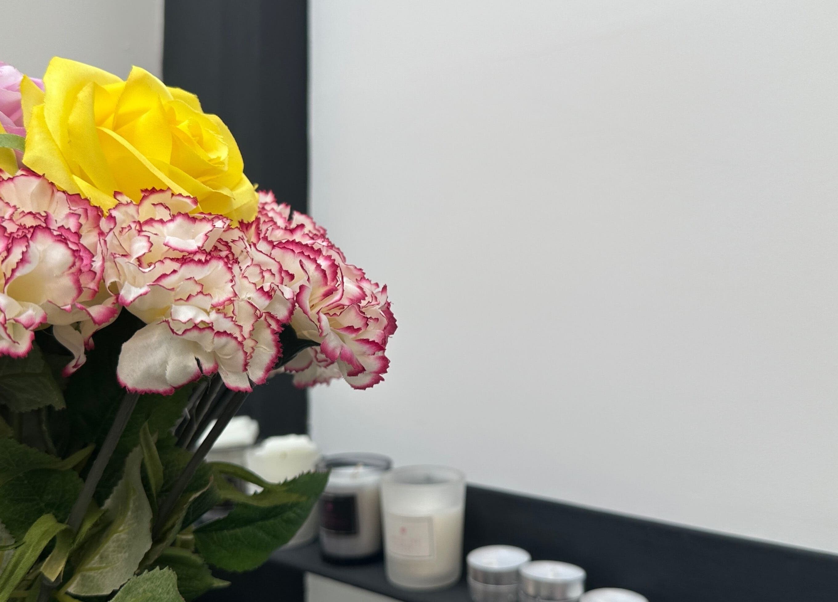 Vibrant flowers and candles at PRF London | JazLooks, Wembley, England, GB create a calming ambiance.
