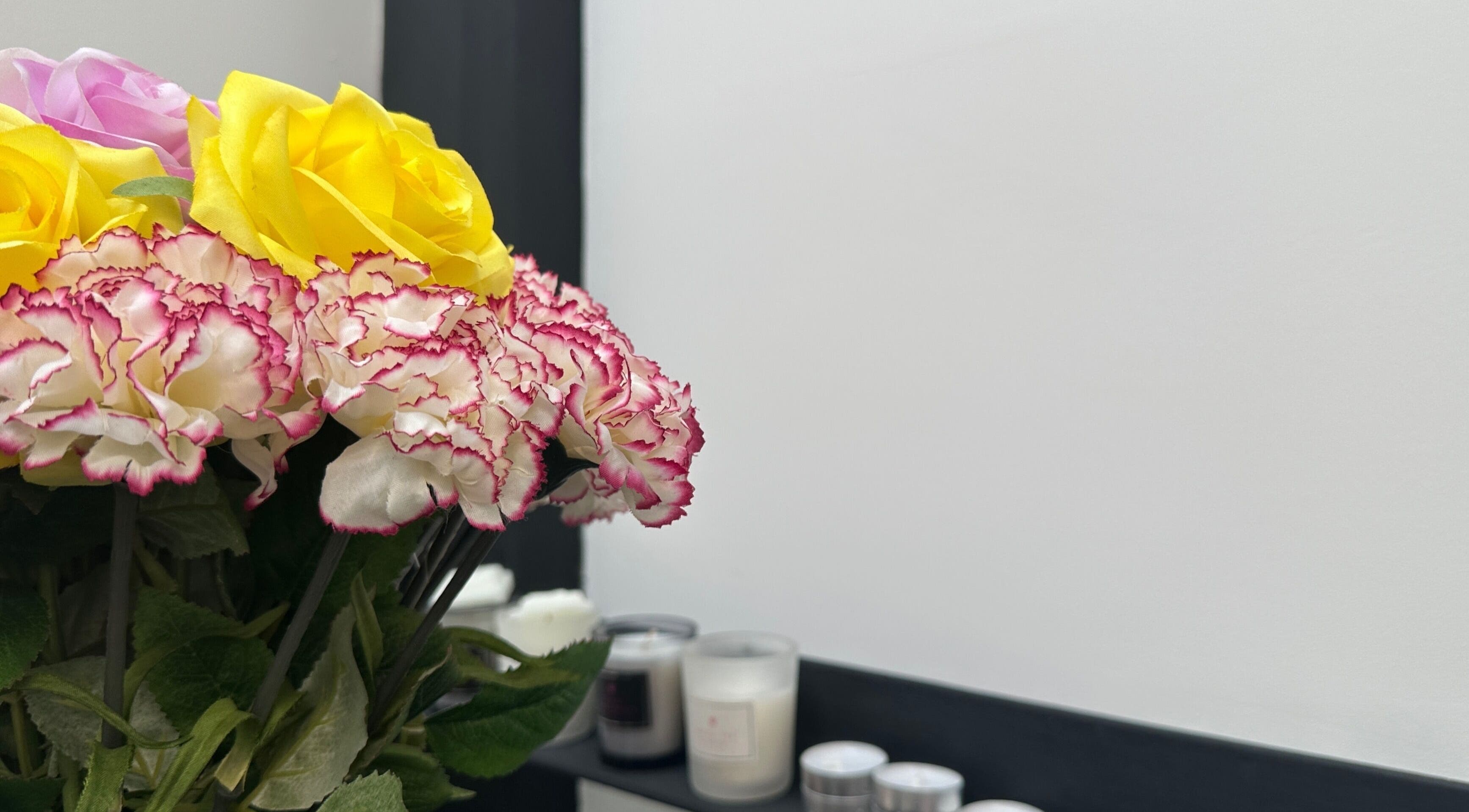 Vibrant flowers and candles at PRF London | JazLooks, Wembley, England, GB create a calming ambiance.