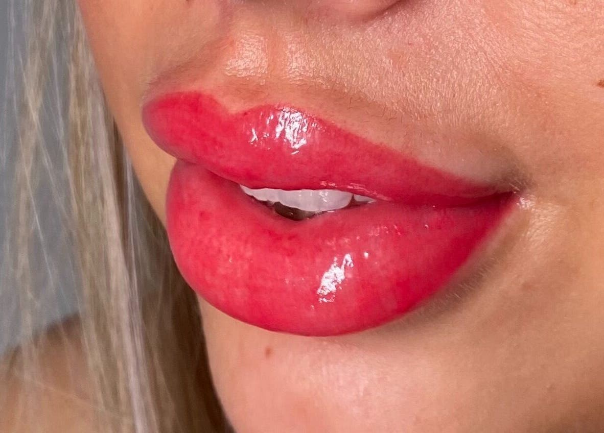 Close-up of glossy red lips from PRF London | JazLooks, Wembley, England, GB.