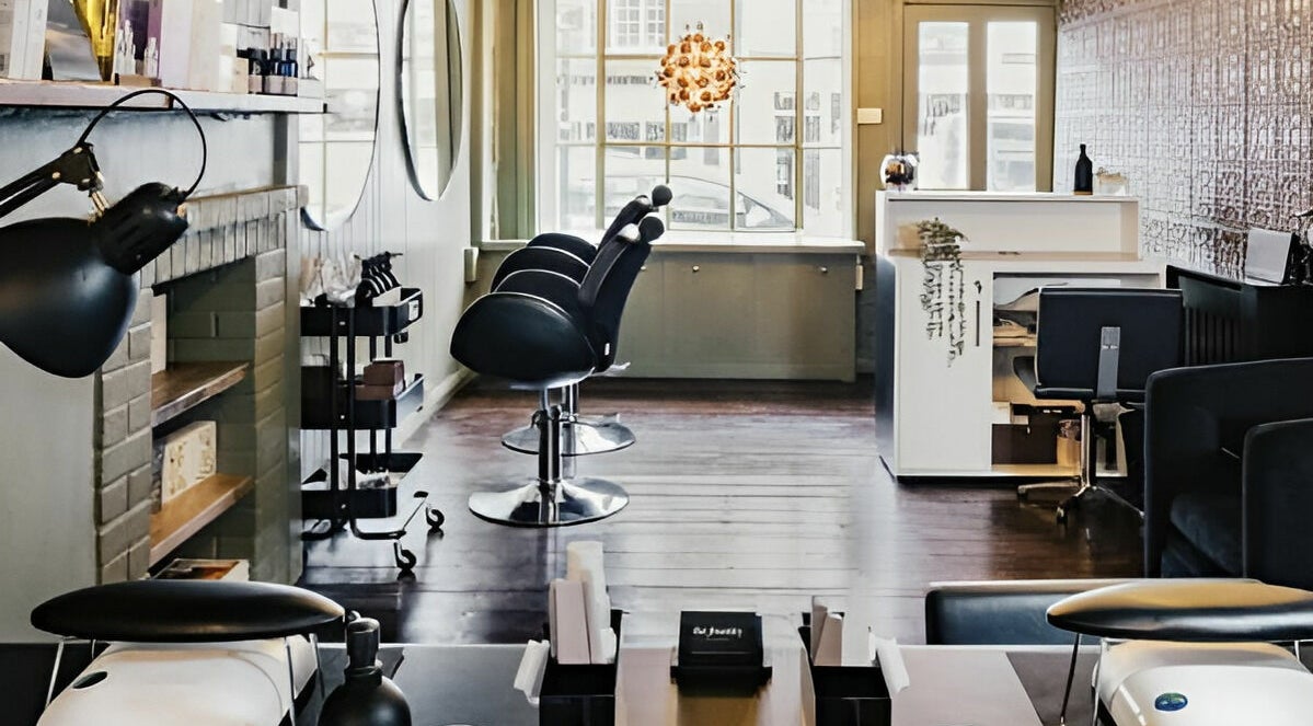 Elegant salon interior at The Foundry, Cranbrook, England, GB, featuring modern styling chairs and decor.