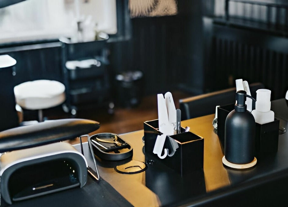 Professional manicure station at The Foundry, Cranbrook, England, GB showcasing sleek tools and polish.
