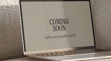 Laptop screen displaying 'Coming Soon' for CAZA STUDIO in Mont-royal, Québec, CA.