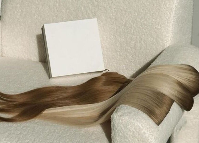 Elegant hair extensions on plush chair at CAZA STUDIO, Mont-royal, Québec, CA.