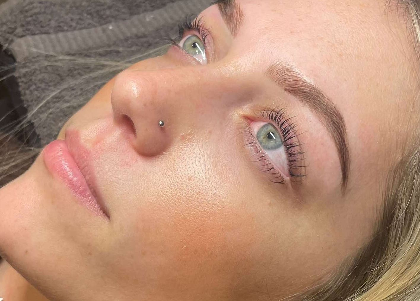 Close-up of a woman's fresh complexion post-treatment at Mason & May, Christchurch, Canterbury, NZ.