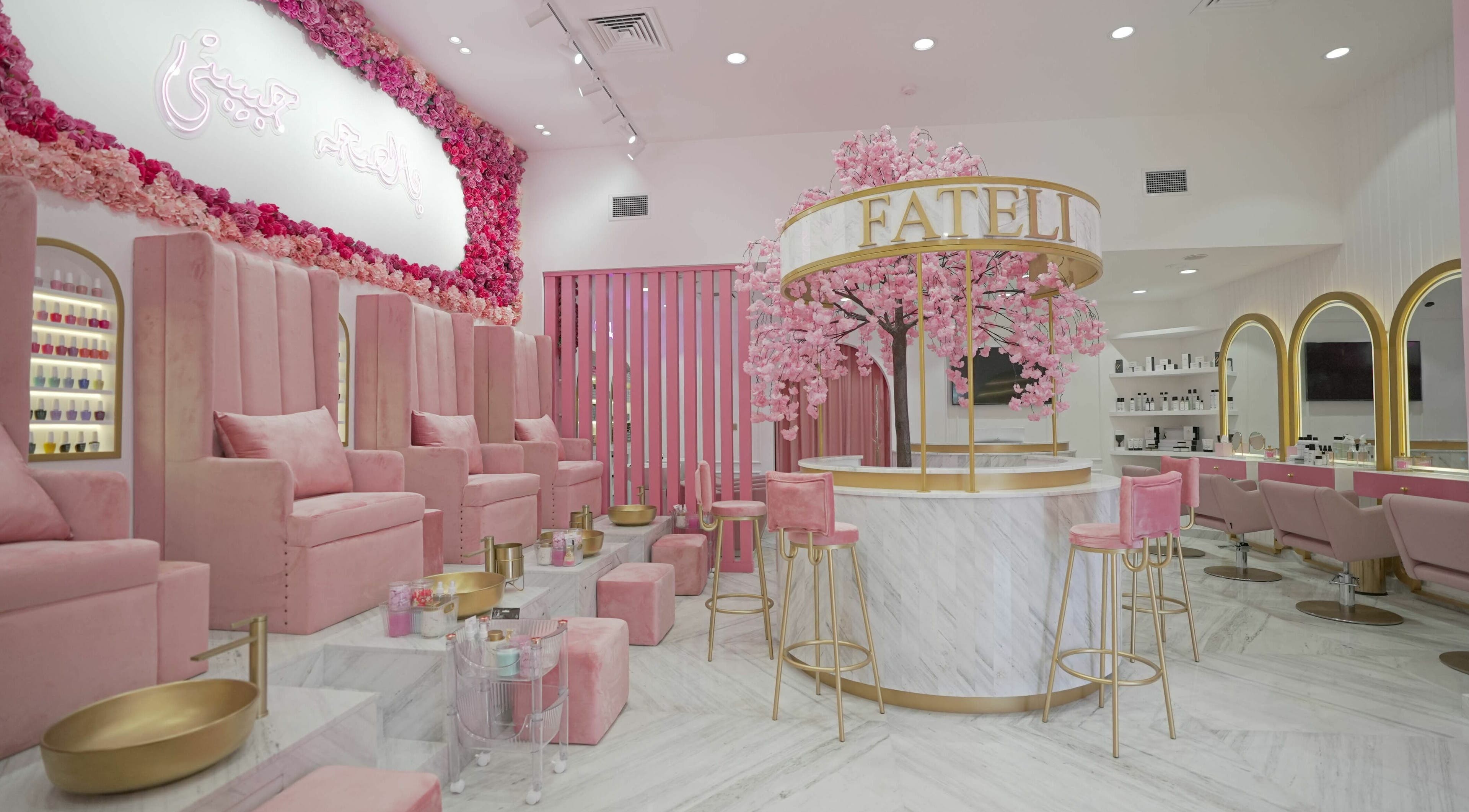 Luxurious pink and gold interior of Fateli Beauty Salon in Dubai, Dubai, AE, featuring elegant seating and decor.