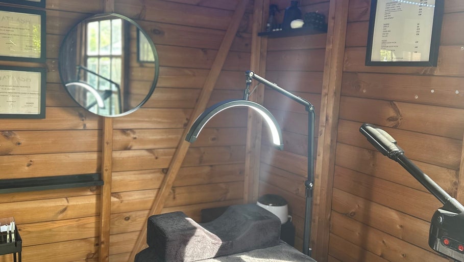 Cozy treatment room at The Beauty Lounge, Wigston, England, GB, featuring a wooden decor and modern equipment.
