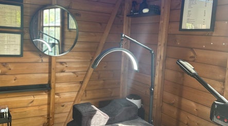 Cozy treatment room at The Beauty Lounge, Wigston, England, GB, featuring a wooden decor and modern equipment.