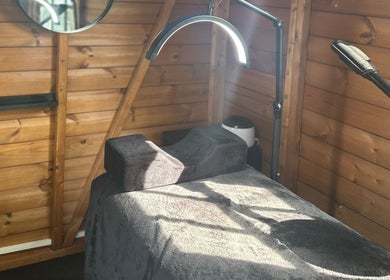 Tranquil therapy bed at The Beauty Lounge, Wigston, England, GB with ambient lighting.