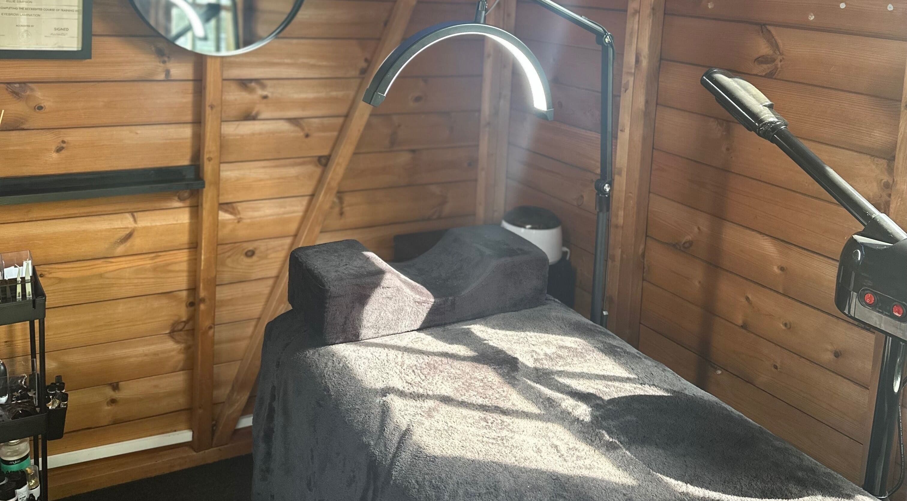 Tranquil therapy bed at The Beauty Lounge, Wigston, England, GB with ambient lighting.