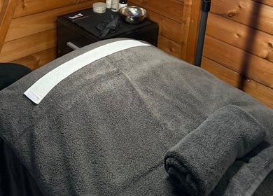 Cozy spa therapy bed at The Beauty Lounge, Wigston, England, GB, inviting relaxation and comfort.